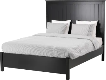 a black bed with white sheets and pillows
