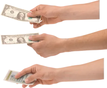 two hands holding money