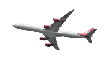 an airplane flying in the sky with a white background