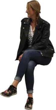 a woman sitting on the ground wearing a black leather jacket