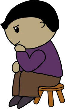 a boy sitting on a stool with his arms crossed