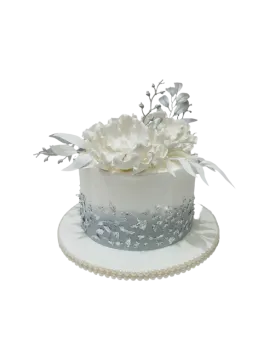 a white cake with flowers on top