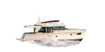 a white boat is driving through the water