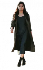 a woman in a black dress and coat