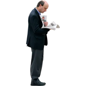 a man in a suit reading a newspaper