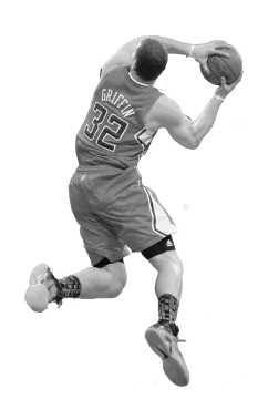 a black and white photo of a basketball player