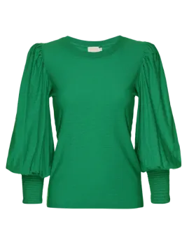 a green top with puff sleeves