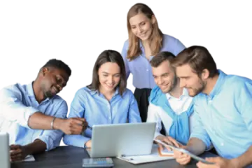 a group of people sitting around a laptop