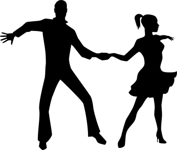 a silhouette of a couple dancing