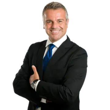 a man in a suit and tie with his arms crossed