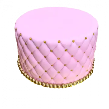 a pink cake with gold decorations on top