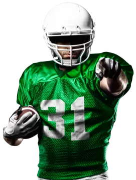 a football player wearing a green uniform and holding a ball