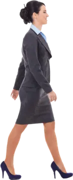 a woman in a business suit is walking