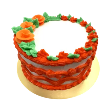 a cake with red frosting and green decorations
