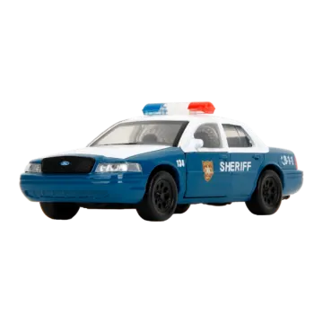 a toy police car on a white background
