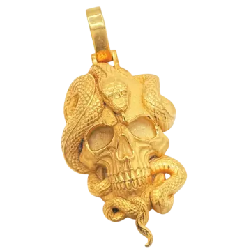 a gold skull pendant on a white background