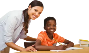 a woman helping a young girl with her homework