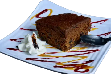 a piece of cake on a plate with a spoon