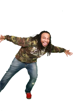 a young man wearing a camo shirt and jeans