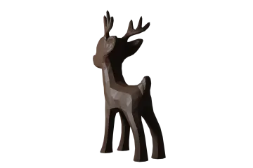 a brown and black deer standing on a white background