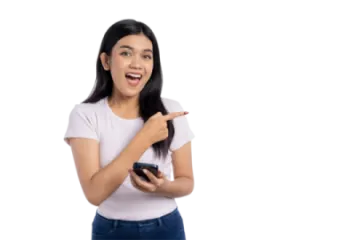 a woman holding a cell phone and smiling