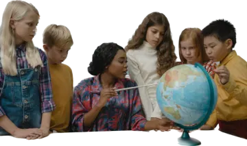 a group of children looking at a globe