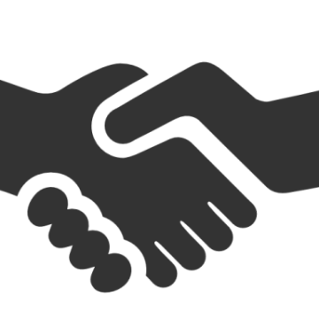 two hands shaking over each other hands