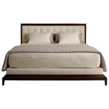 a bed with pillows and pillows on it