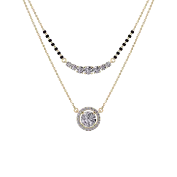 a gold necklace with black and white stones