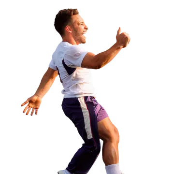a man in a white shirt and purple shorts