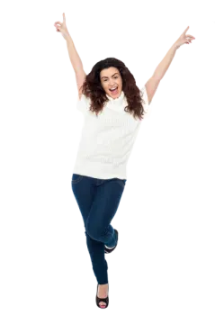 a woman jumping in the air with her arms outstretched