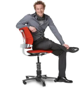 a man sitting on a red office chair
