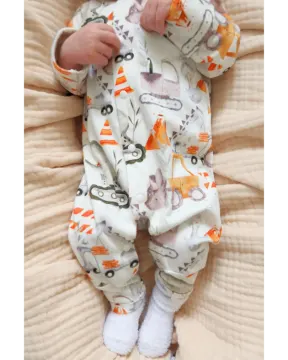 a baby laying on top of a bed