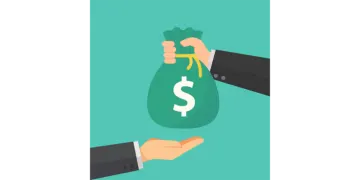 a hand holding a bag of money