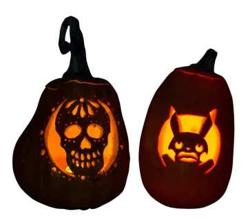 two pumpkins with faces carved into them