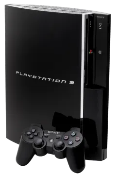 a black playstation game system with two controllers