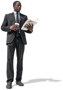 a man in a suit and tie reading a newspaper