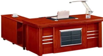 an office desk with a computer on top