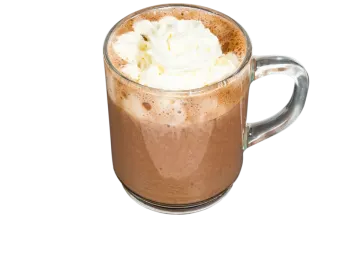 a glass mug filled with chocolate and whipped cream
