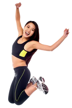 a woman jumping in the air with her arms up