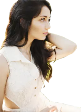 a woman in a white dress posing for the camera
