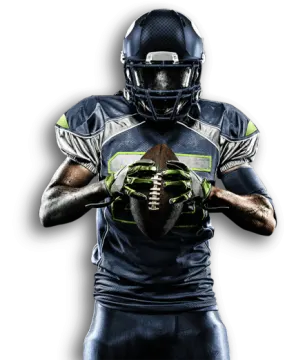 a football player holding a ball in his hands