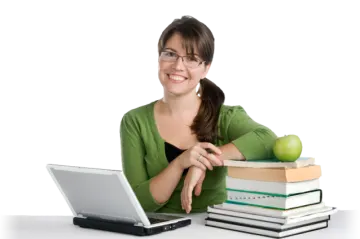 a woman sitting at a desk with books and an apple