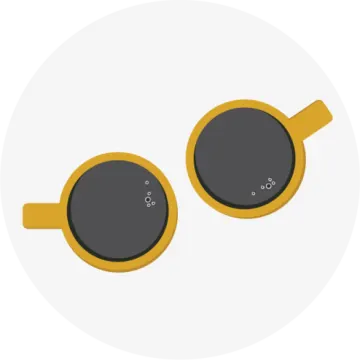 a pair of yellow sunglasses on a white background