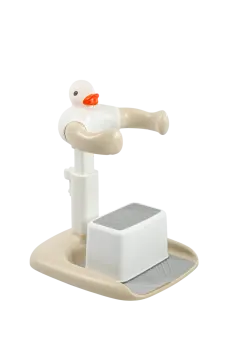 a white bird sitting on top of a scale