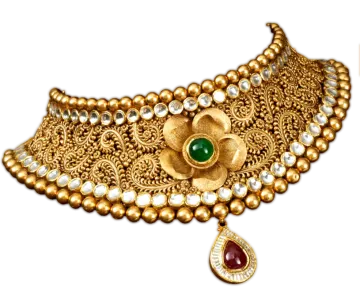 an antique gold choke with emerald and pearls