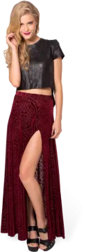 a woman in a black top and red velvet skirt