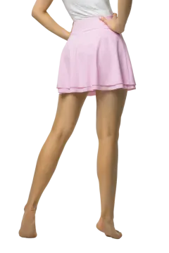 a woman in a white shirt and pink skirt