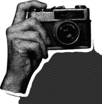 a black and white photo of a hand holding a camera