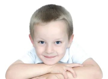 a young boy with his arms crossed